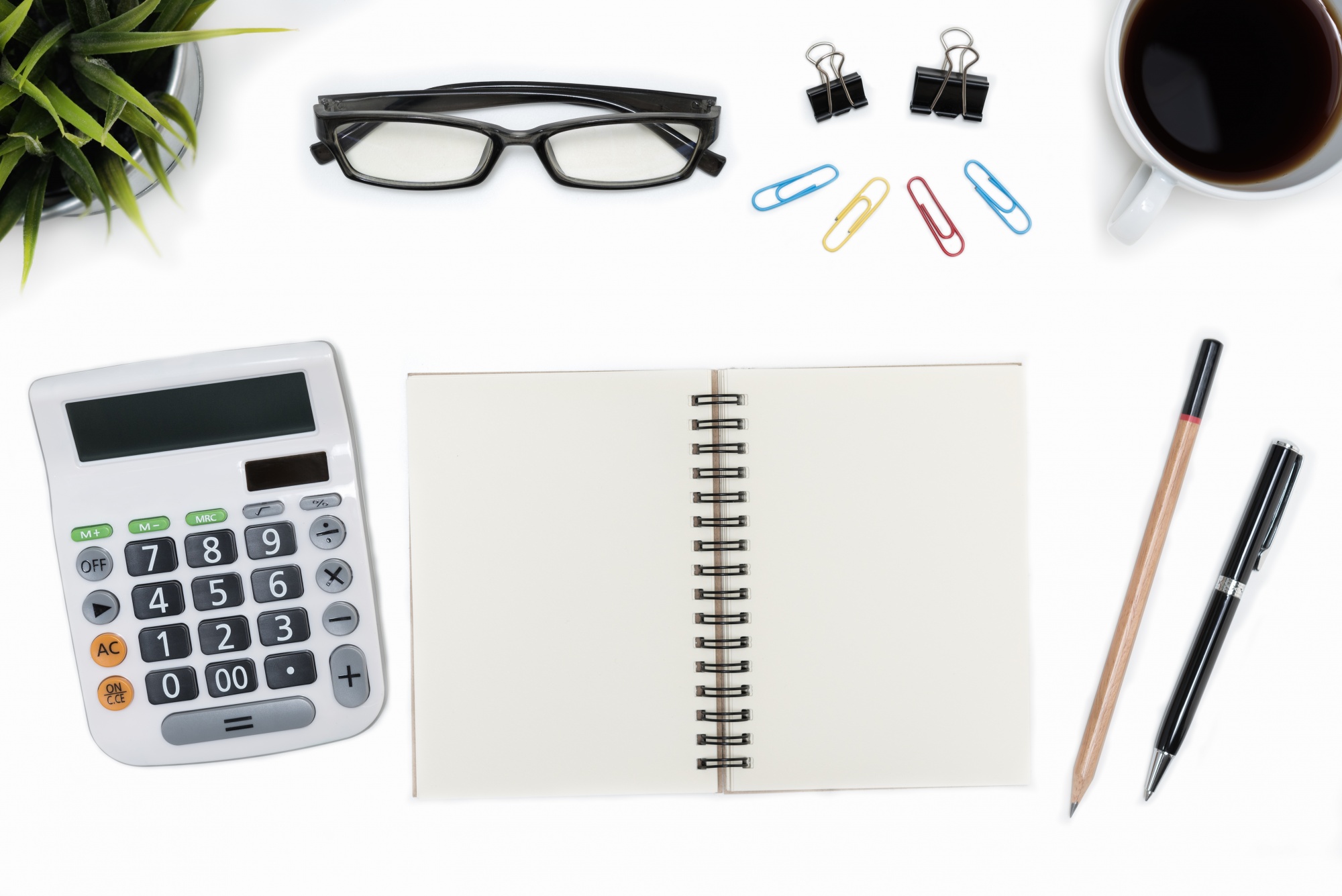 Open notebook with calculator and notes